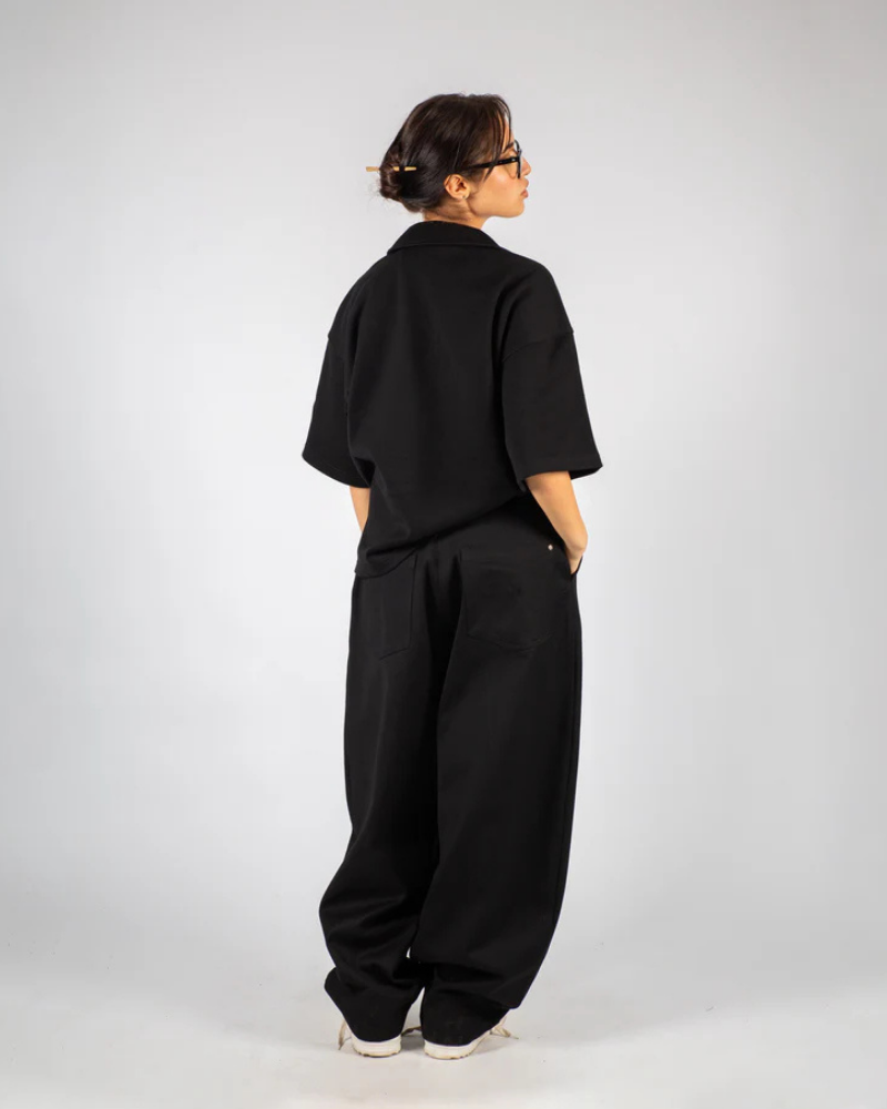 Black Wide-Leg Pleated Pants with Overlapping Waistband and Button Detail